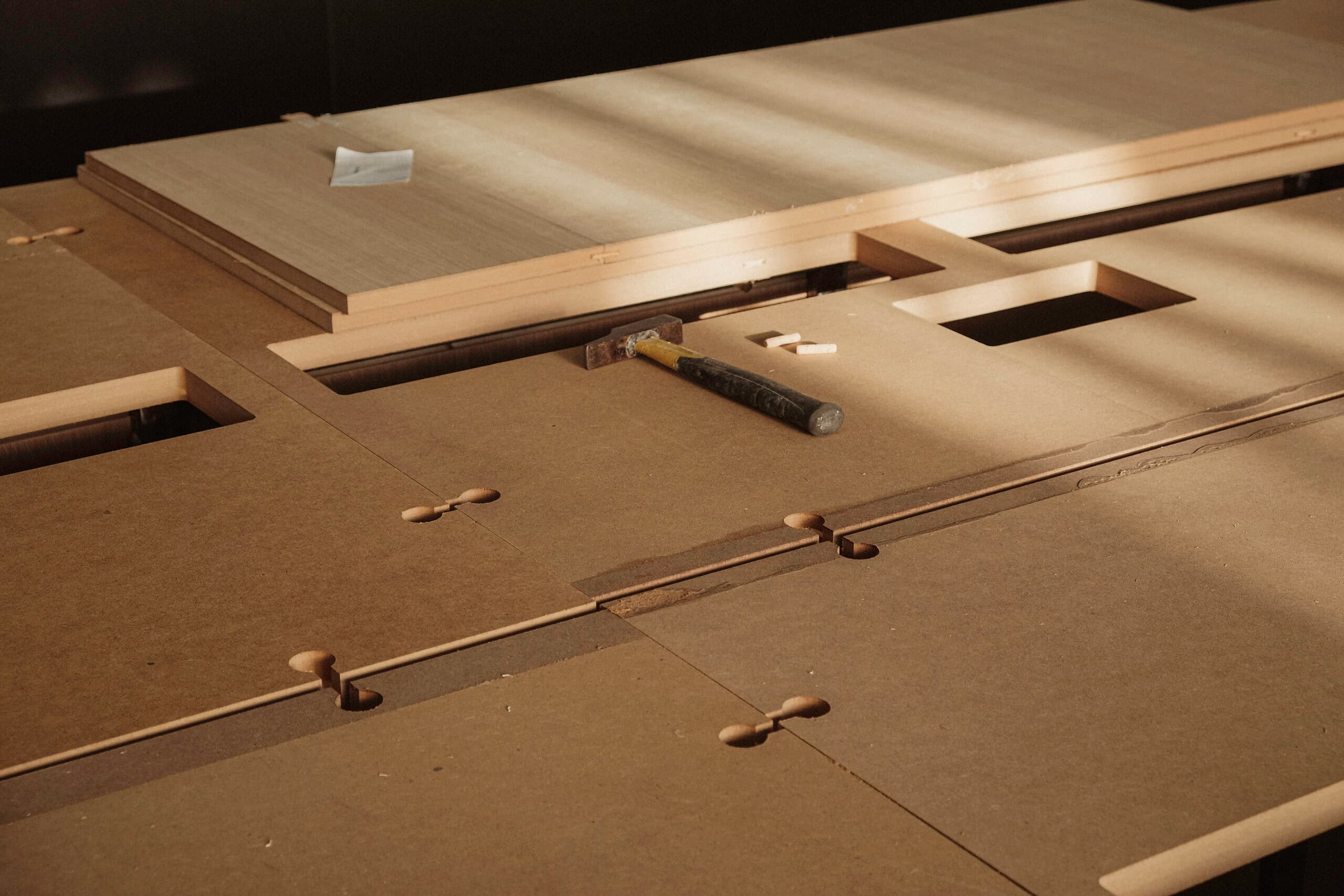 CNC-machined tabletop panels with precision joinery at the KZ Bespoke workshop