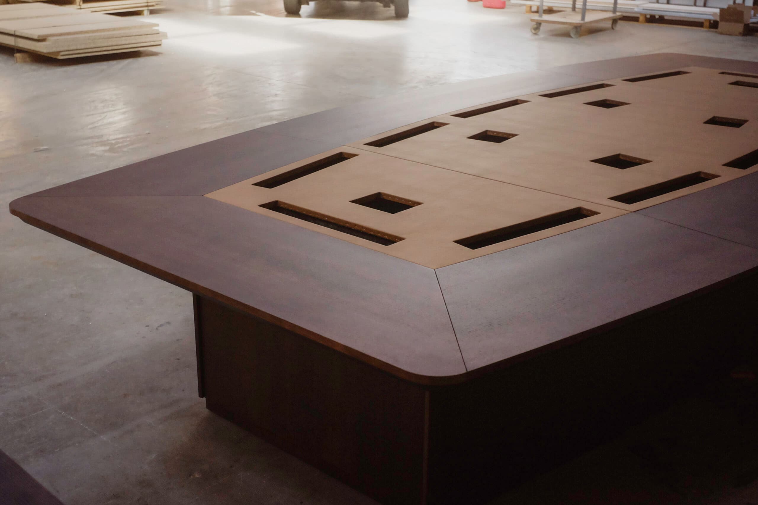 Bespoke conference table with integrated cable management ports by KZ Bespoke