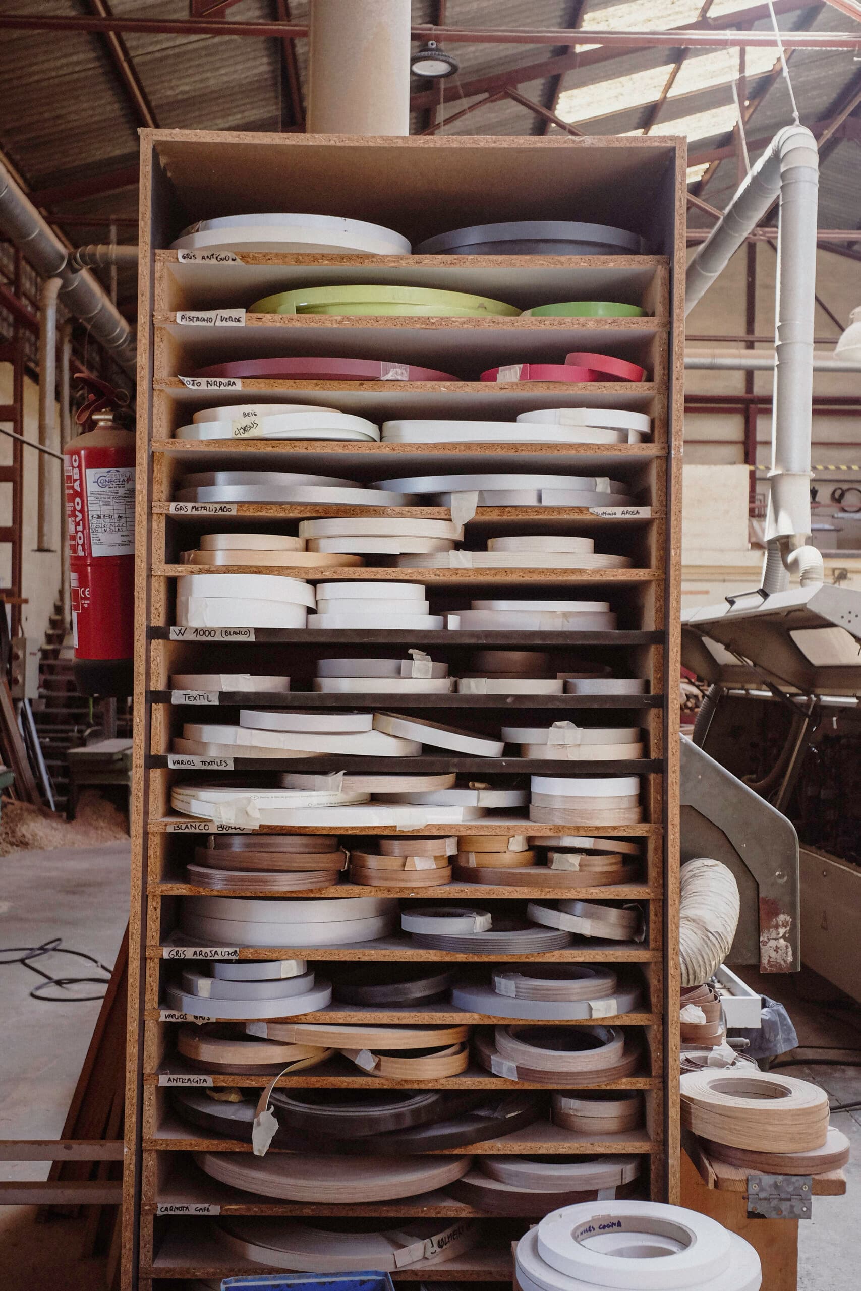 Edge banding rolls in various colours and finishes at the KZ Bespoke workshop